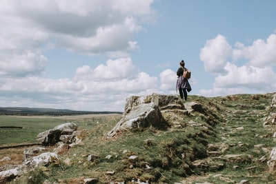 Standing on the outdoor rock girl during the day
